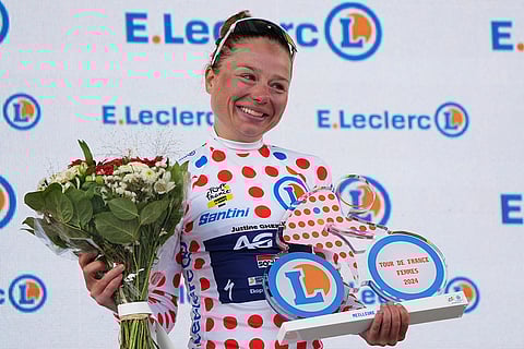 Tour de France Women cycling race: Justine Ghekiere of Belgium, wearing the best climber's dotted jersey, celebrates after the eighth stage